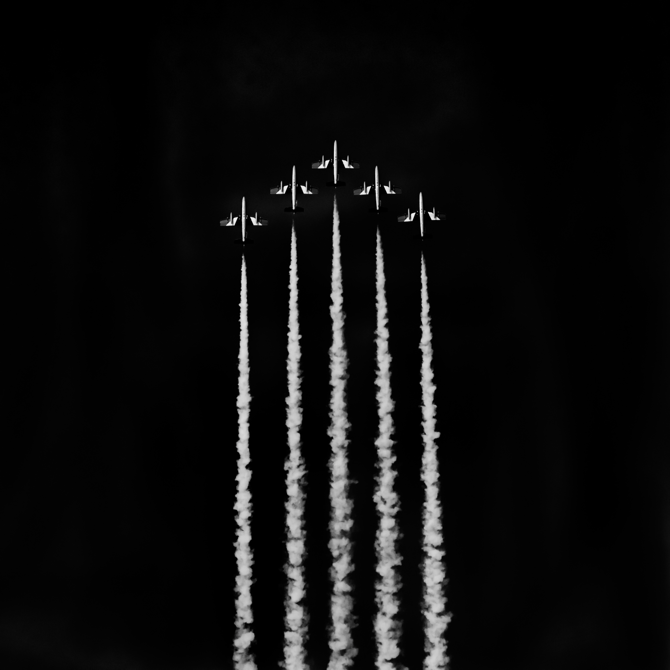 Members of the Frecce Tri Colori aerobatic display squad perform an aerial display in Dubai, United Arab Emirates.