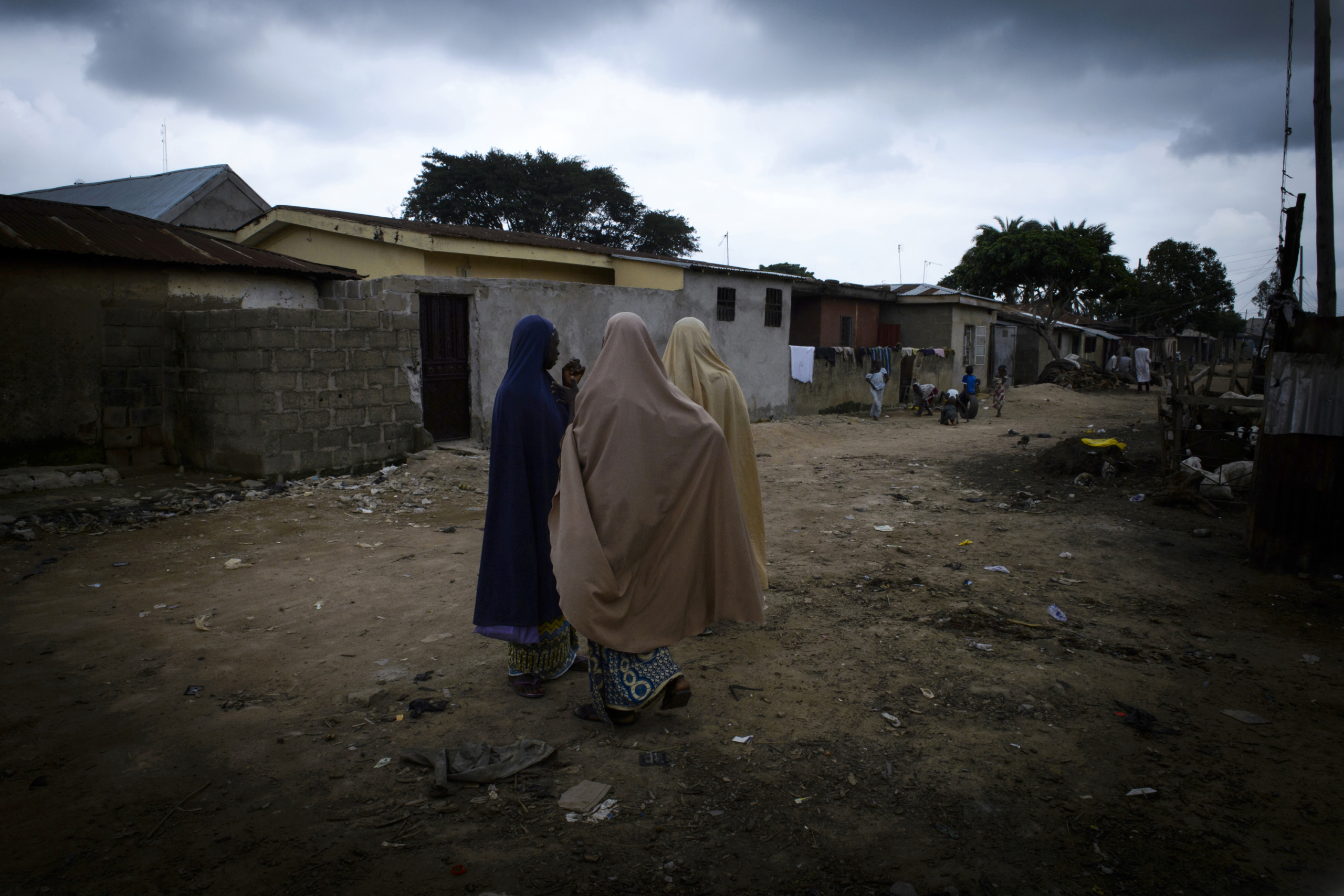 NIGERIA,Kaduna.
Women walk in a street of a Muslim district of kaduna. In the city of Kaduna every community lives in its district. It is rare to find places or Muslim and Christian live together.
Nearly 4,000 people have died in Nigeria due to the violent conflict over the past decade.
The economic and ethnic conflict in the northern states has a religious dimension. It is only with true governance that these conflicting differences could be managed. As elsewhere in Nigeria, residents accuse both local and state government officials for promoting identity-based divisions to advance their own political agendas.