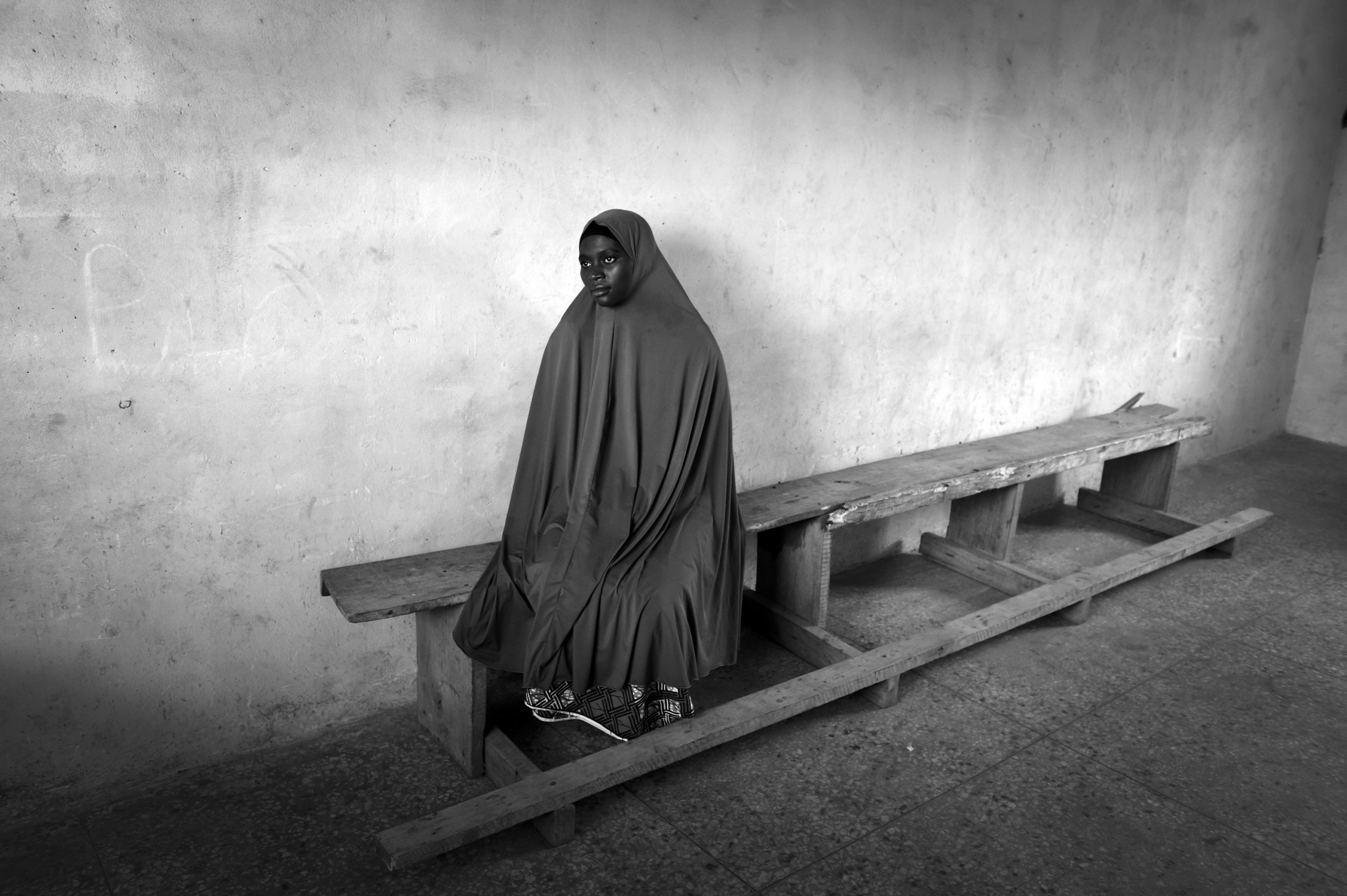 NIGERIA,Kaduna.
A Muslim woman waits that her husband picks her up having taken lessons in a Koranic school in a Muslim district of Kaduna.
Nearly 4,000 people have died in Nigeria due to the violent conflict over the past decade.
The economic and ethnic conflict in the northern states has a religious dimension. It is only with true governance that these conflicting differences could be managed. As elsewhere in Nigeria, residents accuse both local and state government officials for promoting identity-based divisions to advance their own political agendas.