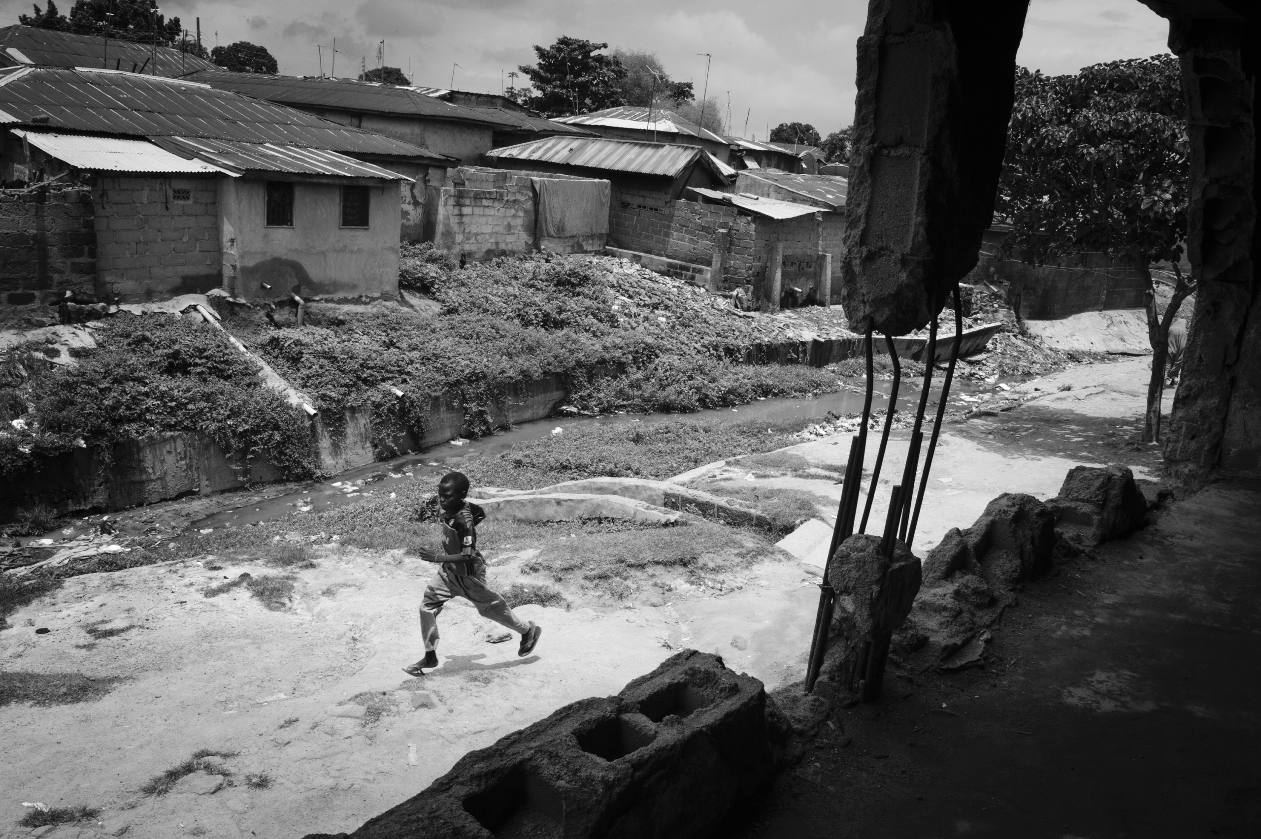 NIGERIA,Kaduna.
A young boy runs in front of a church destroyed during inter-religious confrontations in a Muslim district of Kaduna.
Nearly 4,000 people have died in Nigeria due to the violent conflict over the past decade.
The economic and ethnic conflict in the northern states has a religious dimension. It is only with true governance that these conflicting differences could be managed. As elsewhere in Nigeria, residents accuse both local and state government officials for promoting identity-based divisions to advance their own political agendas.