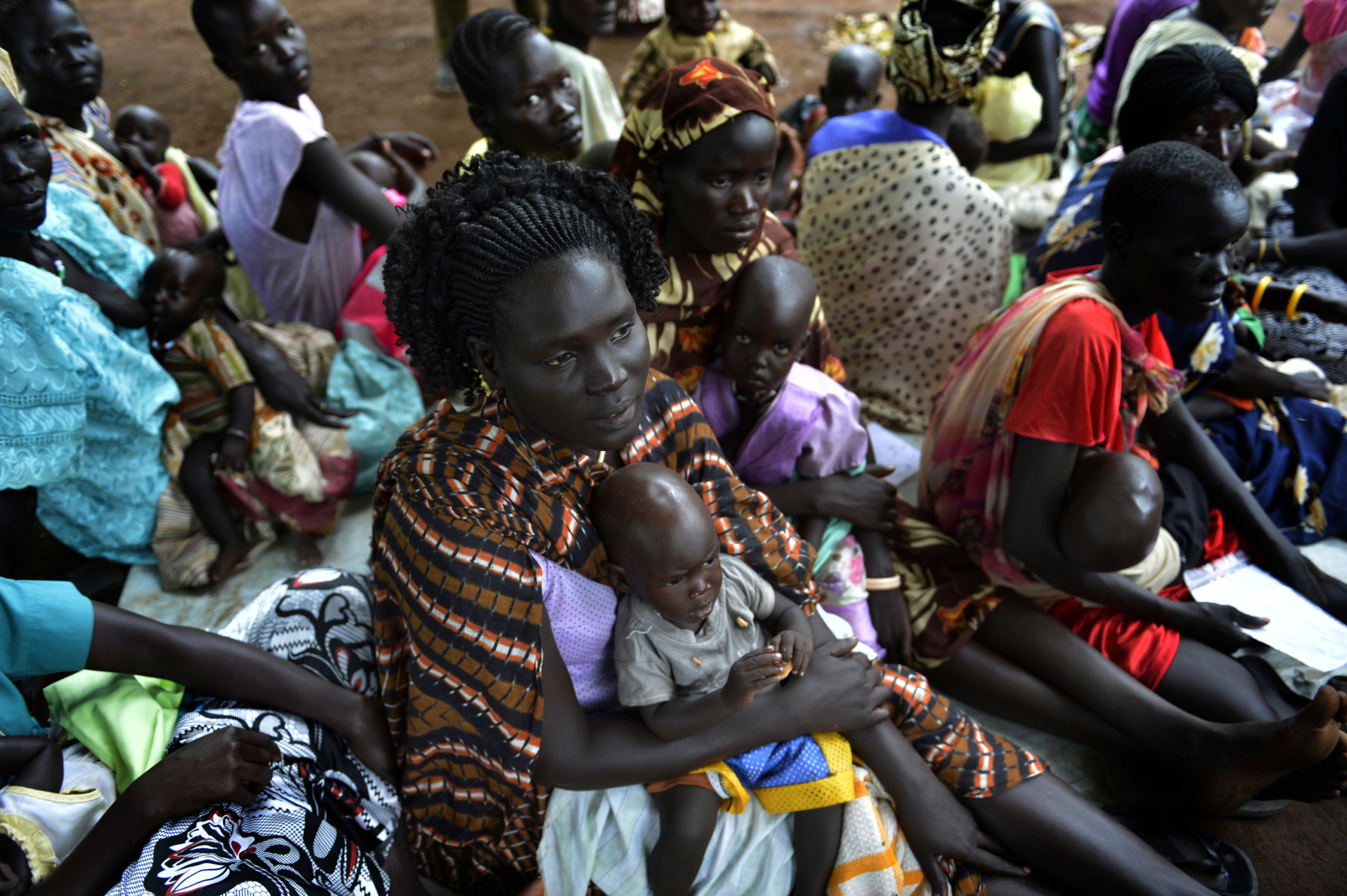 People displaced by fighting in South Sudan wait to be registered into the Kule 1 and 2 camps for Internally Displaced People at the Pagak border crossing in Gambella, Ethiopia, . South Sudan's warring leaders called on each other to restart peace talks on July 9 2014, all the while trading blame for a raging civil war that marred 3 year of independence of South Sudan celebrations in the world's