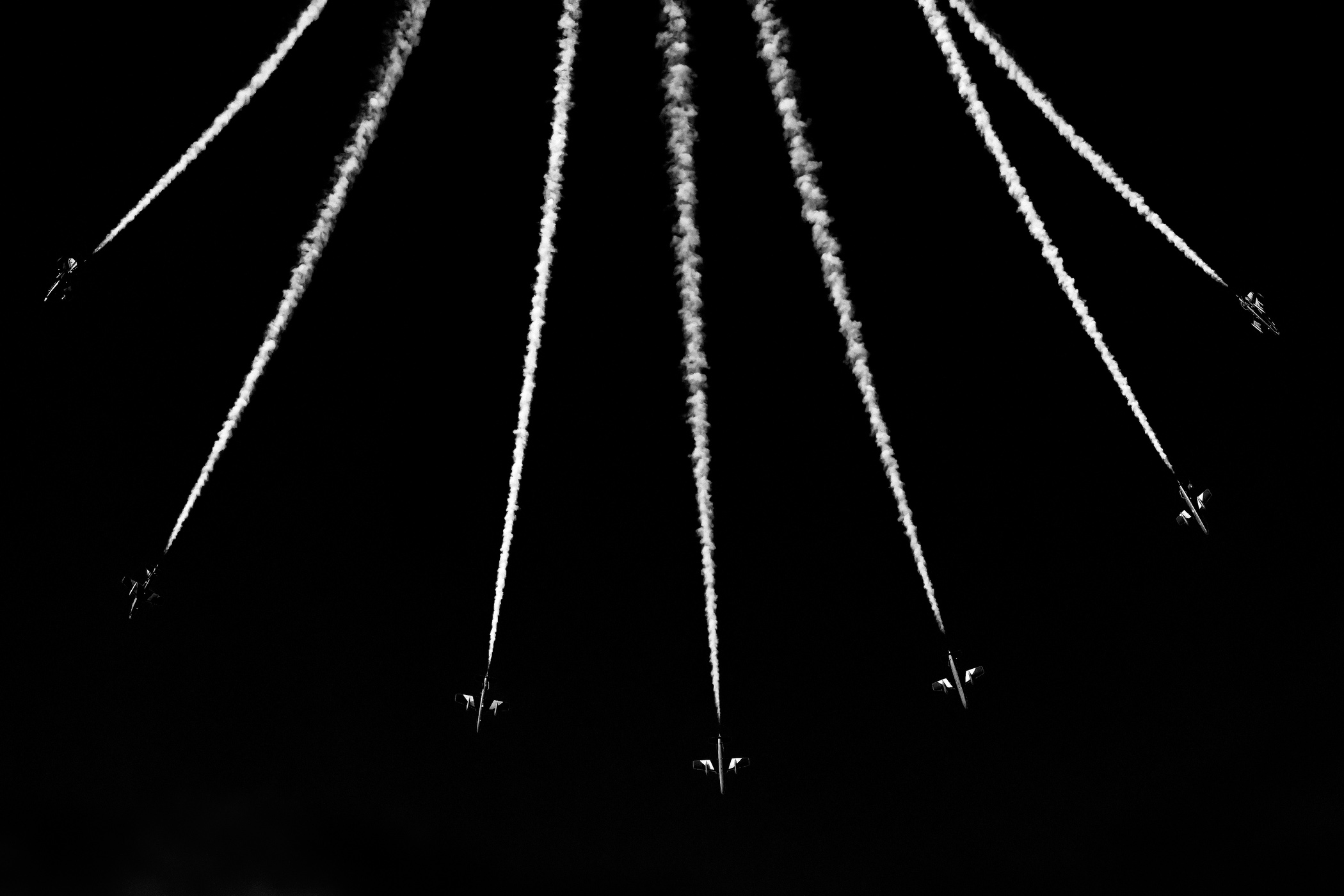 Members of the Frecce Tri Colori aerobatic display squad perform an aerial display in Dubai, United Arab Emirates.