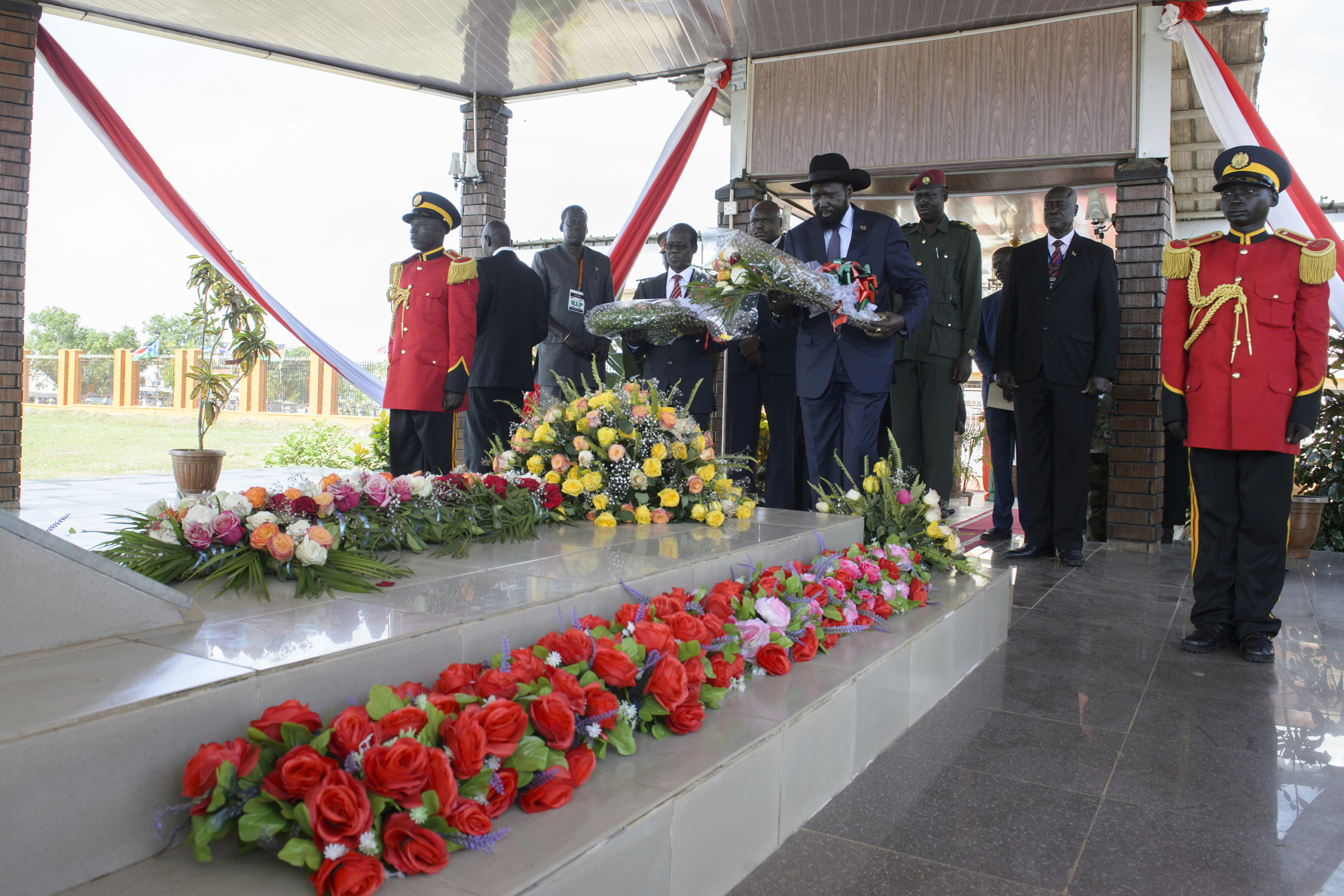— SOUTH SUDAN
Juba, South Sudan.
South Sudan President Salva Kiir stand at attention at the grave of Dr. John Garang at Dr. John Garang Memorial in Juba.
On 9th of July 2011 a new country will be born in Africa. The Republic of South Sudan will be the 54th African state and the 193rd nation in the world. But South Sudan is a very poor country, despite its large oil reserves, which account for 98 percent of its income.
South Sudan’s society is deeply divided along tribal lines. The main clan is the Dinka, a pastoral semi-nomadic population. Violence is endemic to the region, often as a consequences of cattle ownership issues. But violence is also very much fed by the uncountable number of weapons circulating in the country, the heavy legacy of a 30 year long civil war against North Sudan.