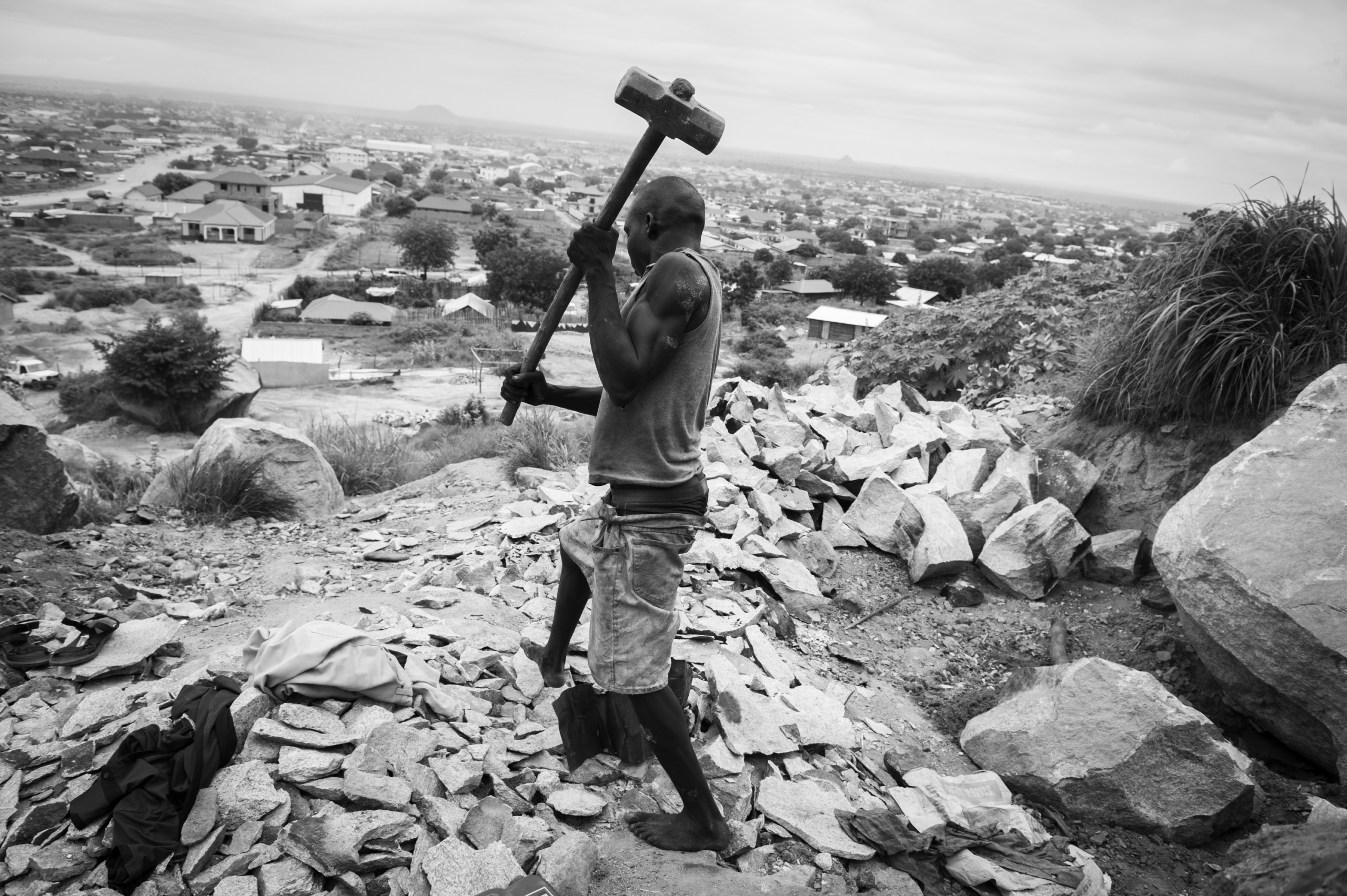 — SOUTH SUDAN
Juba, South Sudan.
A man working in a stone quarry at Juba.
On 9th of July 2011 a new country will be born in Africa. The Republic of South Sudan will be the 54th African state and the 193rd nation in the world. But South Sudan is a very poor country, despite its large oil reserves, which account for 98 percent of its income.
South Sudan’s society is deeply divided along tribal lines. The main clan is the Dinka, a pastoral semi-nomadic population. Violence is endemic to the region, often as a consequences of cattle ownership issues. But violence is also very much fed by the uncountable number of weapons circulating in the country, the heavy legacy of a 30 year long civil war against North Sudan.