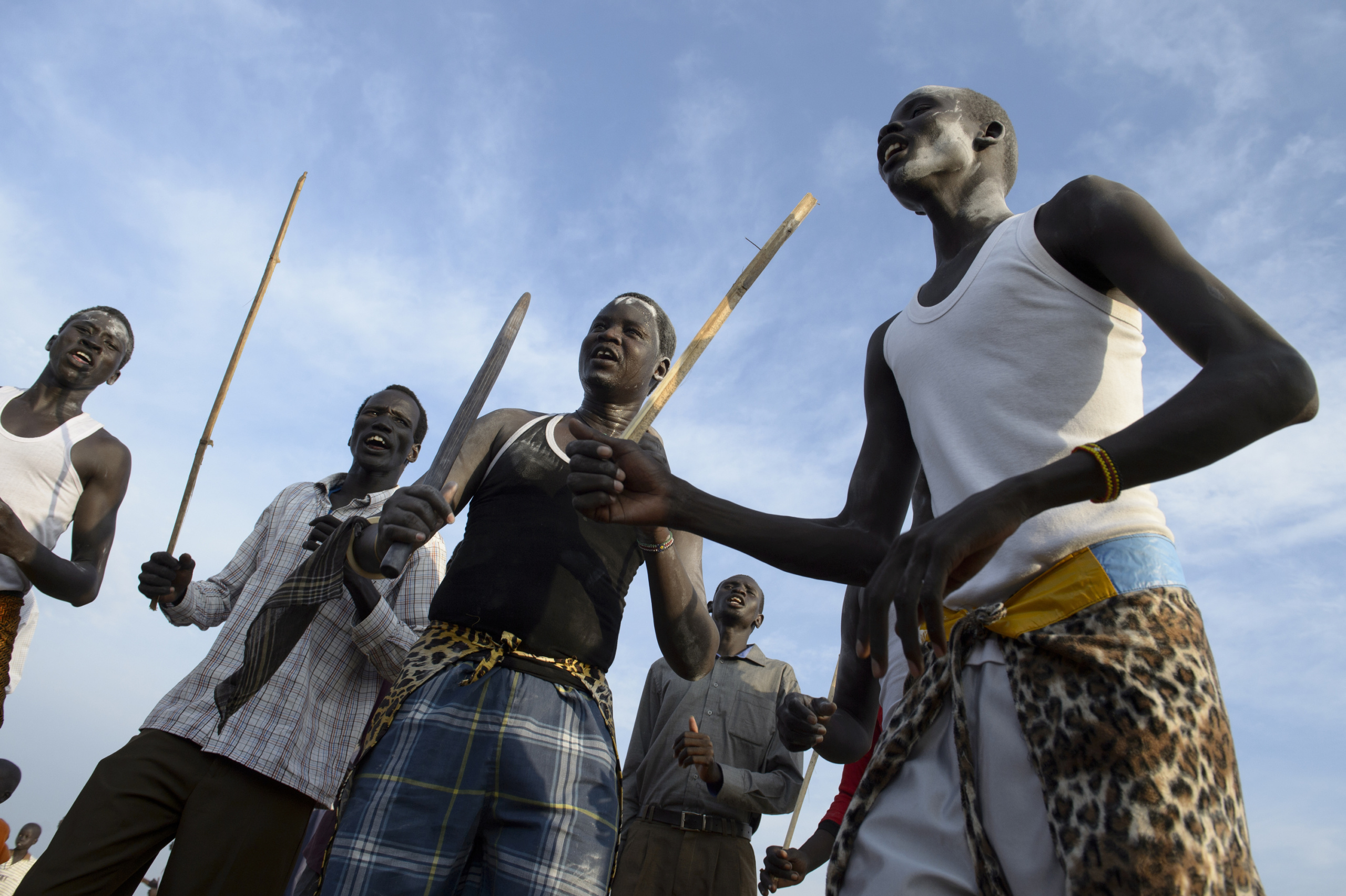 — SOUTH SUDAN
Juba, South Sudan.
Members of the Dinka tribe participate in a traditional celebratory .
On 9th of July 2011 a new country will be born in Africa. The Republic of South Sudan will be the 54th African state and the 193rd nation in the world. But South Sudan is a very poor country, despite its large oil reserves, which account for 98 percent of its income.
South Sudan’s society is deeply divided along tribal lines. The main clan is the Dinka, a pastoral semi-nomadic population. Violence is endemic to the region, often as a consequences of cattle ownership issues. But violence is also very much fed by the uncountable number of weapons circulating in the country, the heavy legacy of a 30 year long civil war against North Sudan.