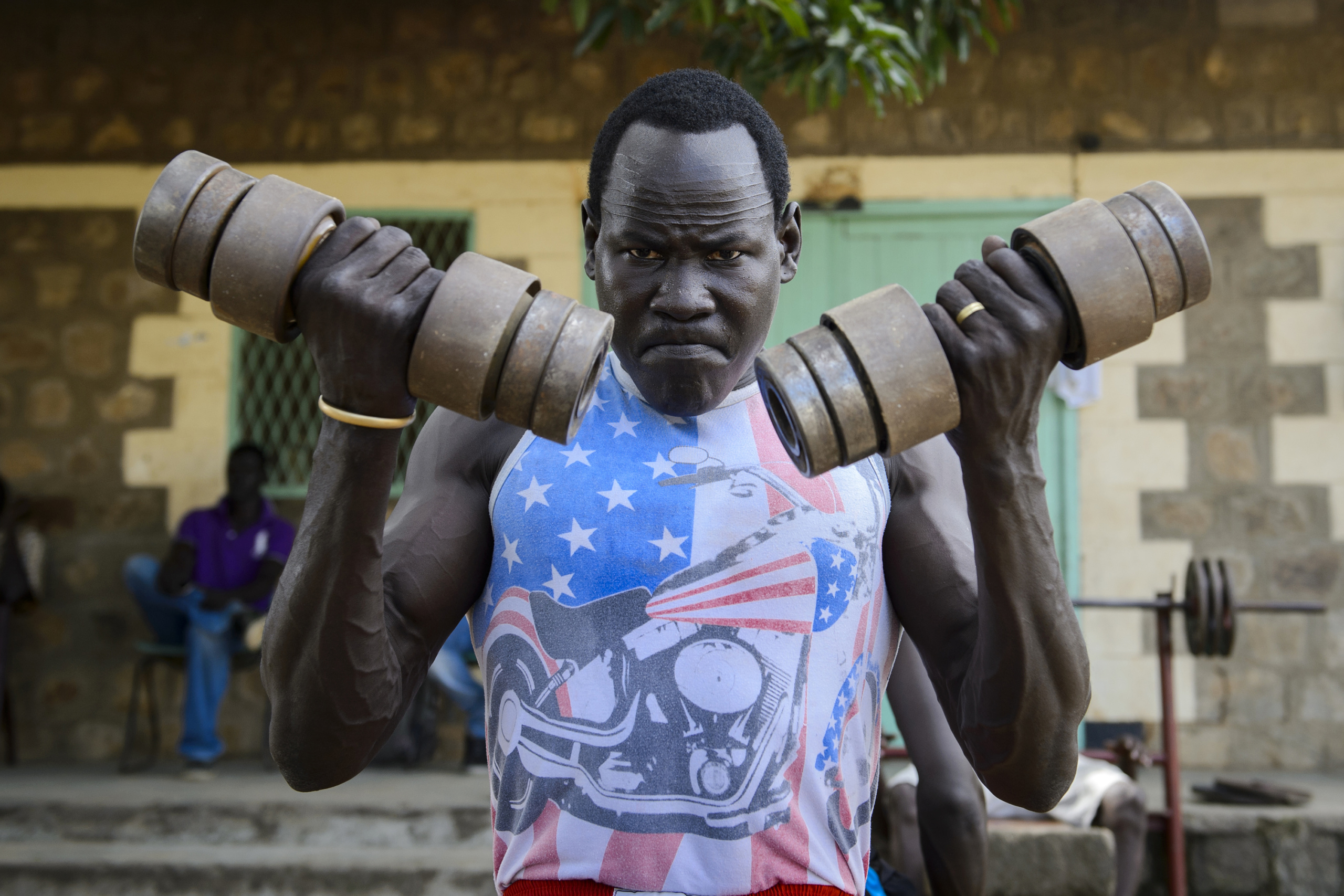 — SOUTH SUDAN
Juba, South Sudan.
A boxer during training .
On 9th of July 2011 a new country will be born in Africa. The Republic of South Sudan will be the 54th African state and the 193rd nation in the world. But South Sudan is a very poor country, despite its large oil reserves, which account for 98 percent of its income.
South Sudan’s society is deeply divided along tribal lines. The main clan is the Dinka, a pastoral semi-nomadic population. Violence is endemic to the region, often as a consequences of cattle ownership issues. But violence is also very much fed by the uncountable number of weapons circulating in the country, the heavy legacy of a 30 year long civil war against North Sudan.
