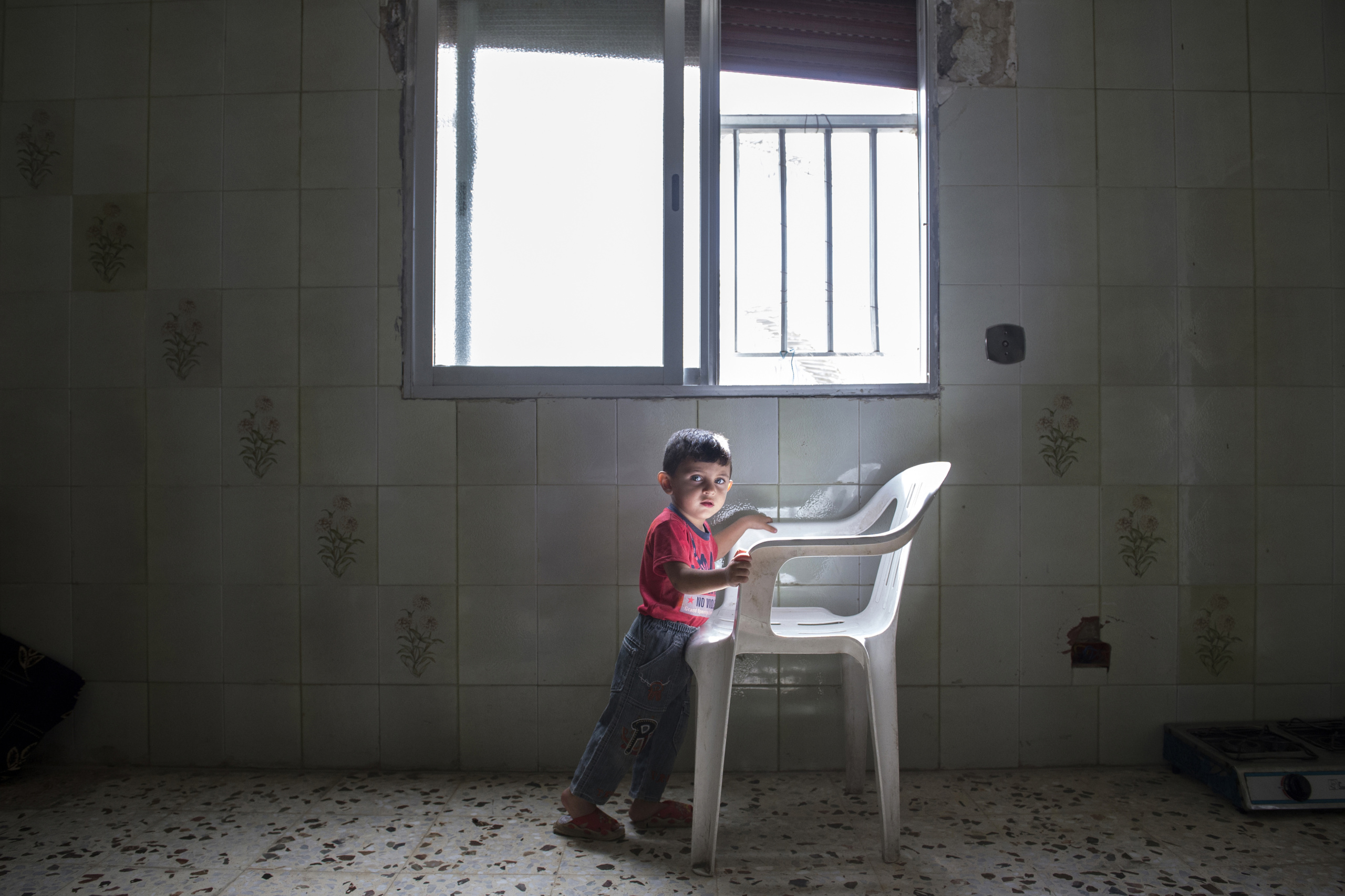 Saida-Lebanon.
Child in an abandoned construction site occupied by Syrian refugees. The refugees try to survive through public subsidies and underpaid labor.
the Lebanese government will not allow traditional refugee camps in Lebanon, refugees are finding unusual places to live across the country, including unfinished homes, abandoned shopping malls and schools …….