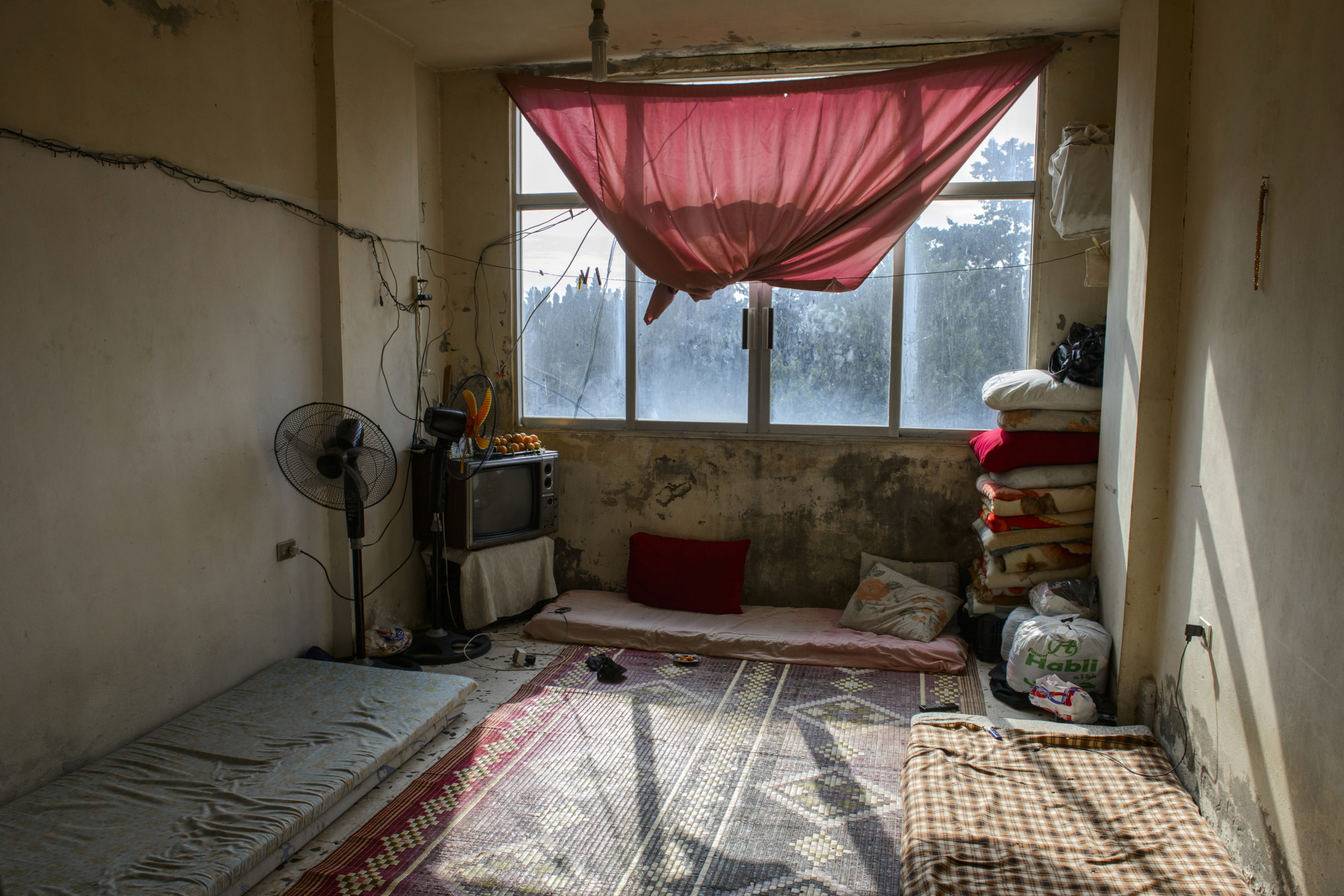 Saida-Lebanon.
A room inside an abandoned construction site occupied by Syrian refugees.This building is located in the center of Saida . The owner gave access electricity and water free of charge to refugees. . The refugees try to survive through public subsidies and underpaid labor.
the Lebanese government will not allow traditional refugee camps in Lebanon, refugees are finding unusual places to live across the country, including unfinished homes, abandoned shopping malls and schools .......