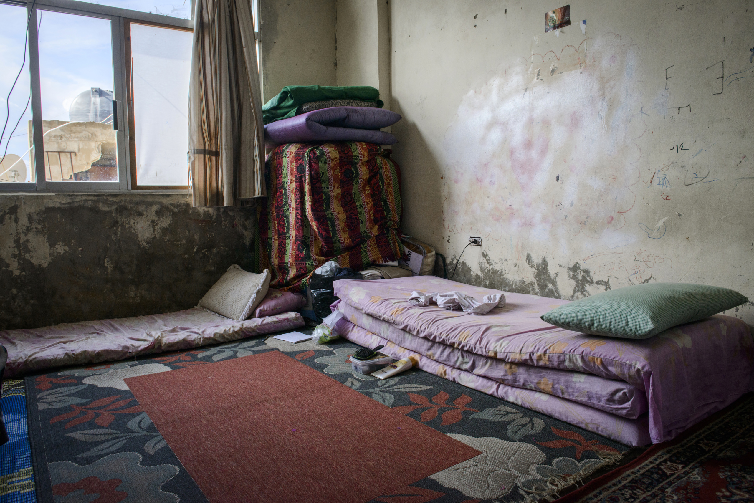 Saida-Lebanon.
A room inside an abandoned construction site occupied by Syrian refugees.This building is located in the center of Saida . The owner gave access electricity and water free of charge to refugees. . The refugees try to survive through public subsidies and underpaid labor.
the Lebanese government will not allow traditional refugee camps in Lebanon, refugees are finding unusual places to live across the country, including unfinished homes, abandoned shopping malls and schools .......