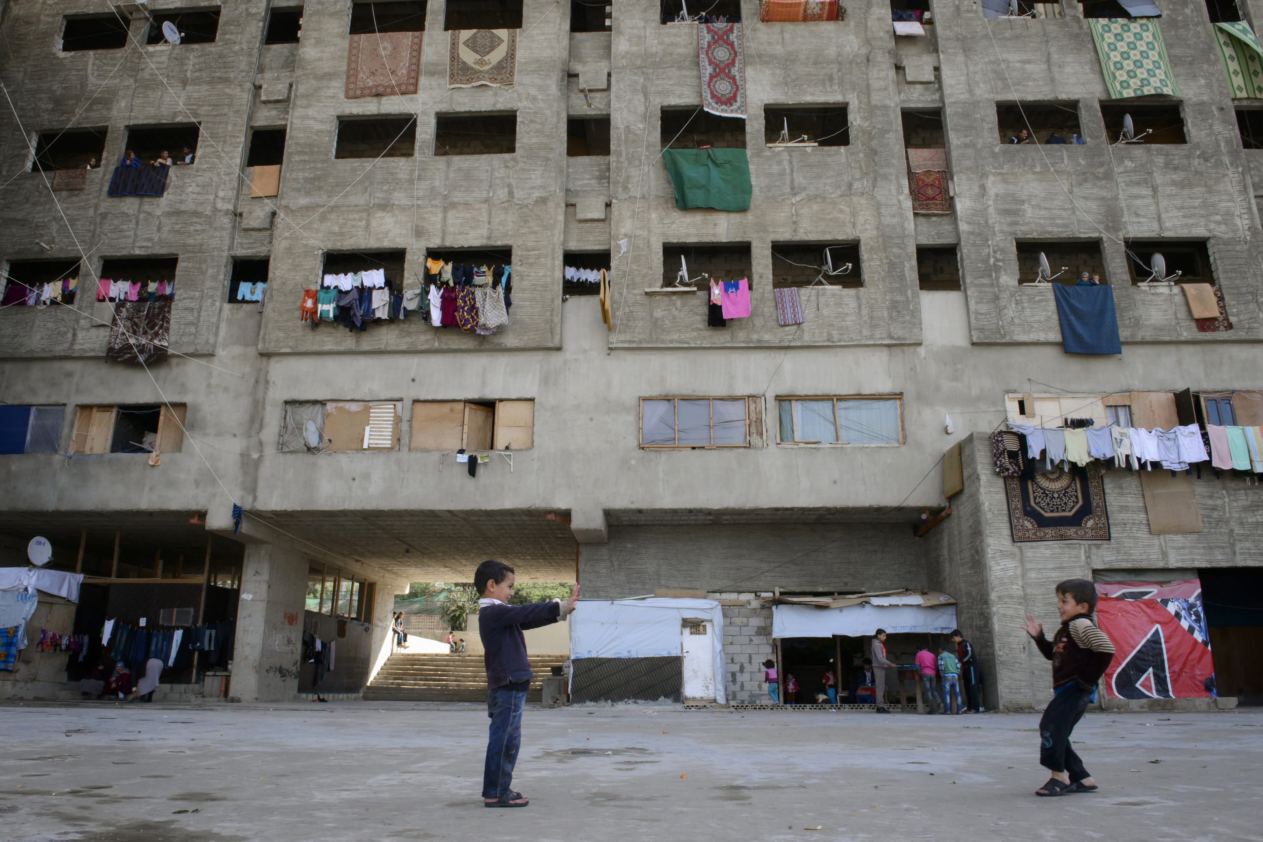 Saida-Lebanon.
An abandoned construction site occupied by Syrian refugees. This building, referred to as a “collective shelter”, is owned by the Islamic University and financed by a Kuwaiti association. About 150 families live within it, all from the Syrian Daraa region. The refugees try to survive through public subsidies and underpaid labor.
the Lebanese government will not allow traditional refugee camps in Lebanon, refugees are finding unusual places to live across the country, including unfinished homes, abandoned shopping malls and schools .......