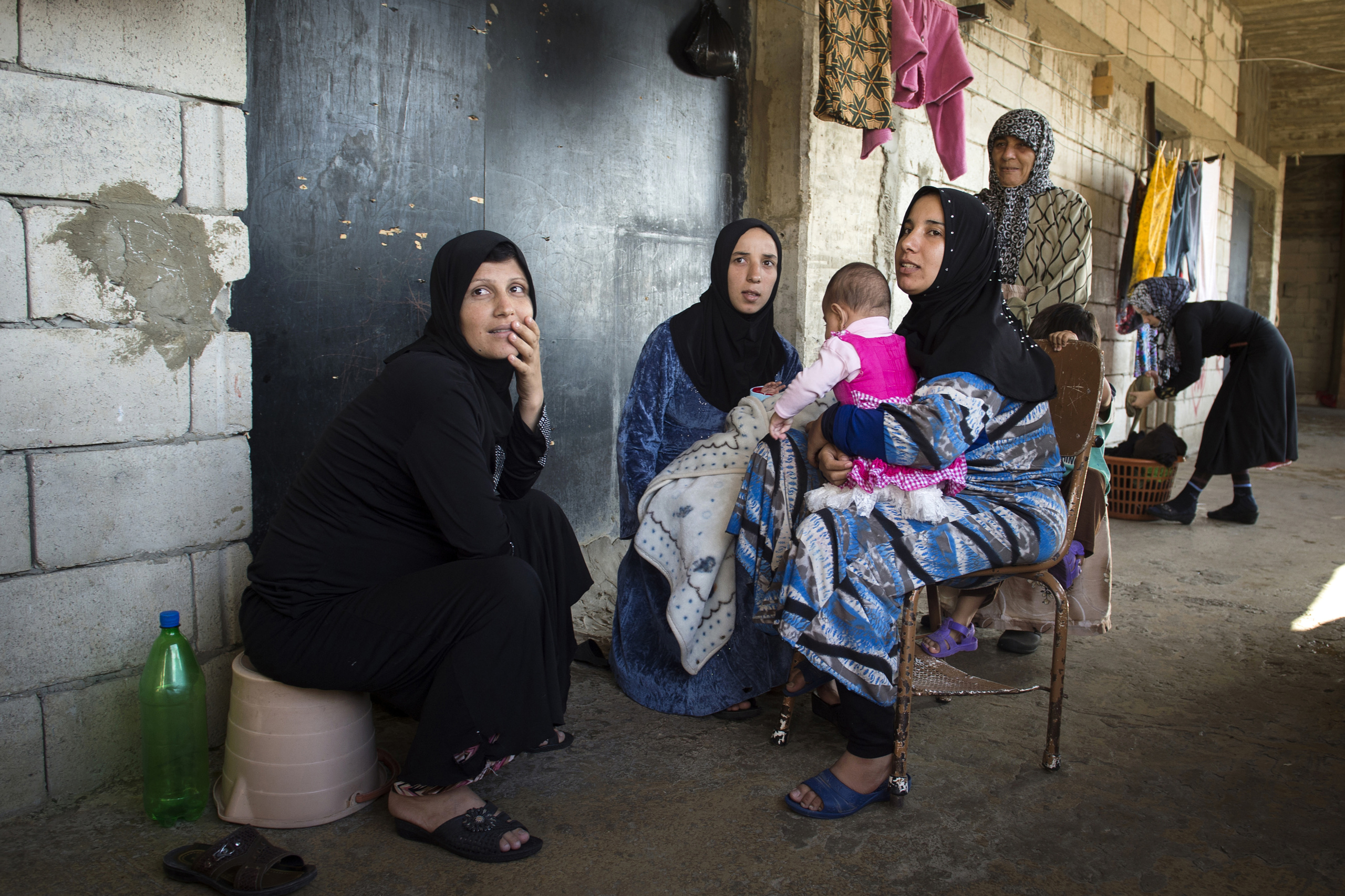 Saida-Lebanon.
Women inside an abandoned construction site occupied by Syrian refugees. This building, referred to as a “collective shelter”, is owned by the Islamic University and financed by a Kuwaiti association. About 150 families live within it, all from the Syrian Daraa region. The refugees try to survive through public subsidies and underpaid labor.
the Lebanese government will not allow traditional refugee camps in Lebanon, refugees are finding unusual places to live across the country, including unfinished homes, abandoned shopping malls and schools …….