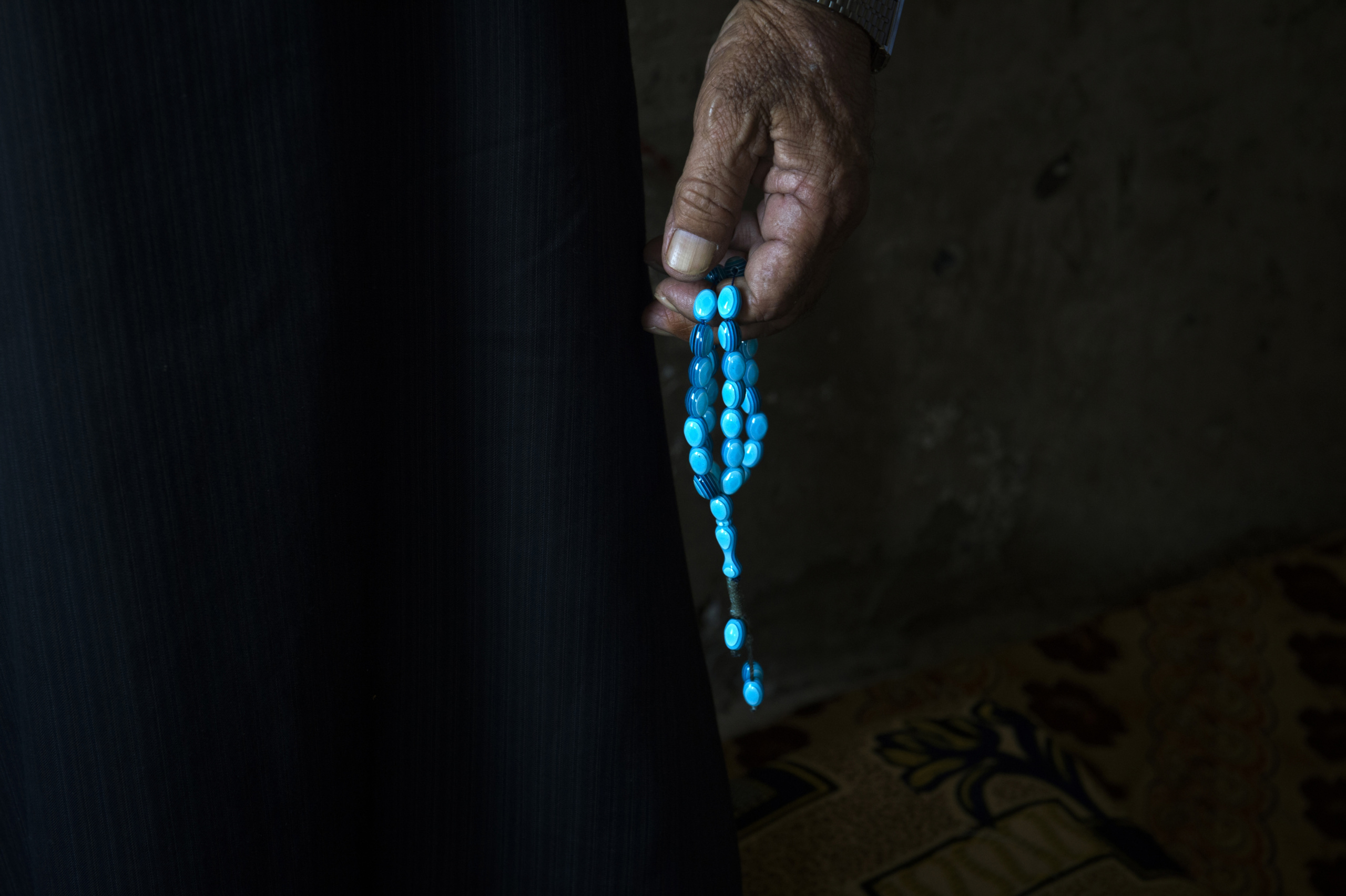 Saida-Lebanon.
A man with is Tasbih inside a shelter.
the Lebanese government will not allow traditional refugee camps in Lebanon, refugees are finding unusual places to live across the country, including unfinished homes, abandoned shopping malls and schools …….