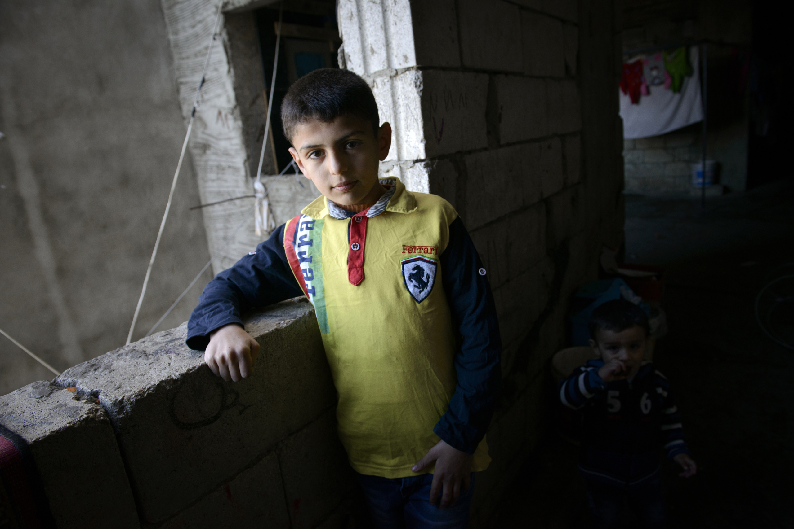 Saida-Lebanon.
A child inside an abandoned construction site occupied by Syrian refugees. This building, referred to as a “collective shelter”, is owned by the Islamic University and financed by a Kuwaiti association. About 150 families live within it, all from the Syrian Daraa region. The refugees try to survive through public subsidies and underpaid labor.
the Lebanese government will not allow traditional refugee camps in Lebanon, refugees are finding unusual places to live across the country, including unfinished homes, abandoned shopping malls and schools .......