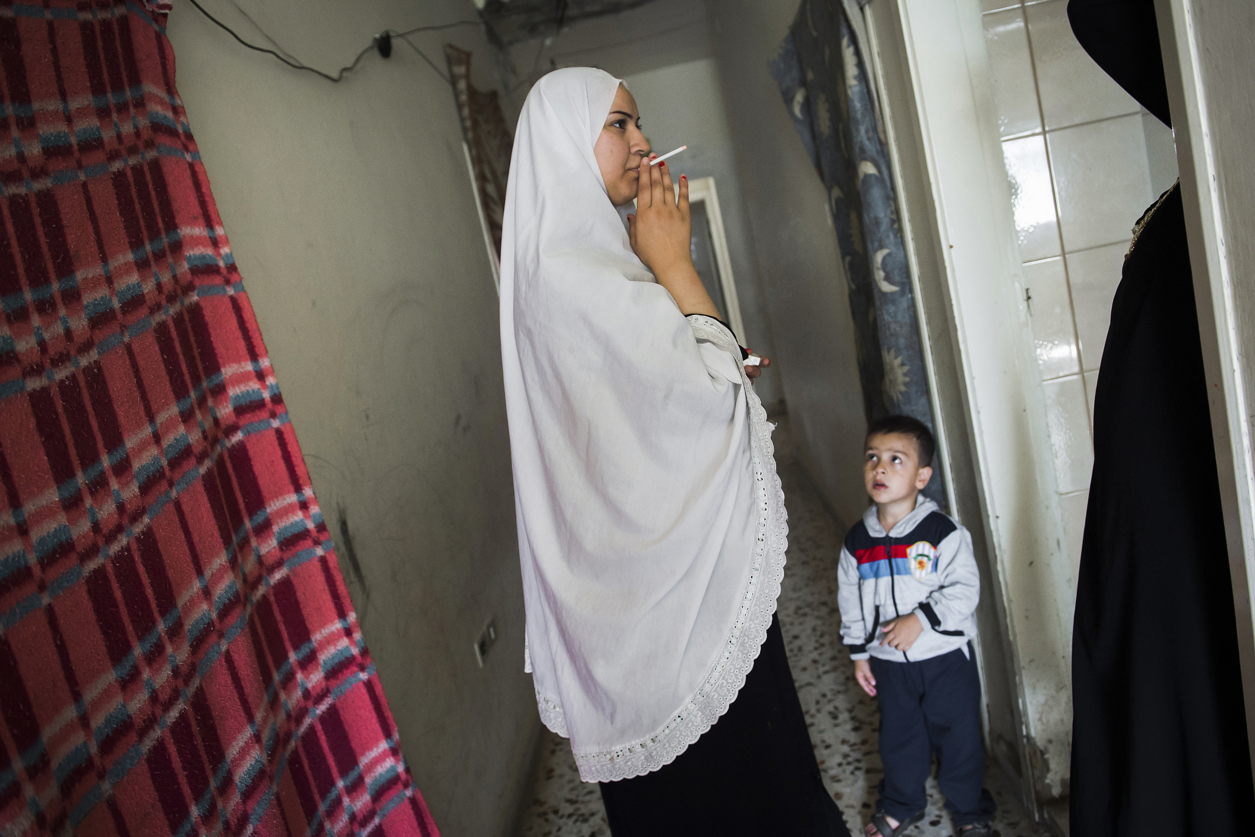 Saida-Lebanon.
A mon and is child inside a collective shelter.
the Lebanese government will not allow traditional refugee camps in Lebanon, refugees are finding unusual places to live across the country, including unfinished homes, abandoned shopping malls and schools …….