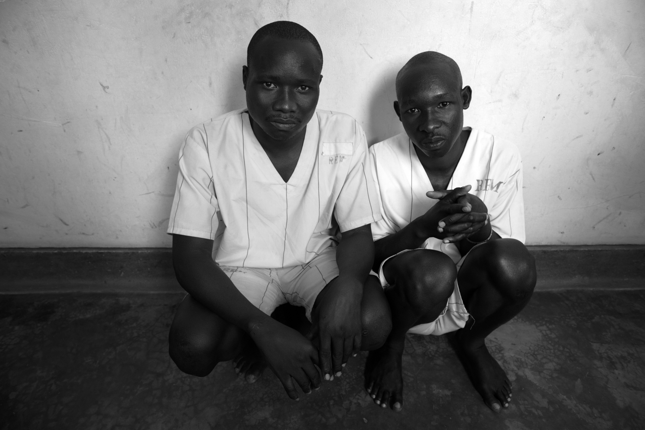 Soroti,UGANDA.
Uganda Government Prison of Soroti.
Two brothers await their trial at Sorotti prison. They are accused of murdering their neighbor who wanted to take their land.
90% of inmates are imprisoned for killing people after land conflict.
Land conflicts will escalate in at least 30 districts of Uganda unless urgent measures are taken to resolve them. The conflicts include border disputes with neighboring countries, inter-district border disputes, wrangles between landlords and their tenants and tenants resisting acquisition of land by investors.
For many years numerous land conflicts and disputes have left parties dead or at least vowing to kill each other.