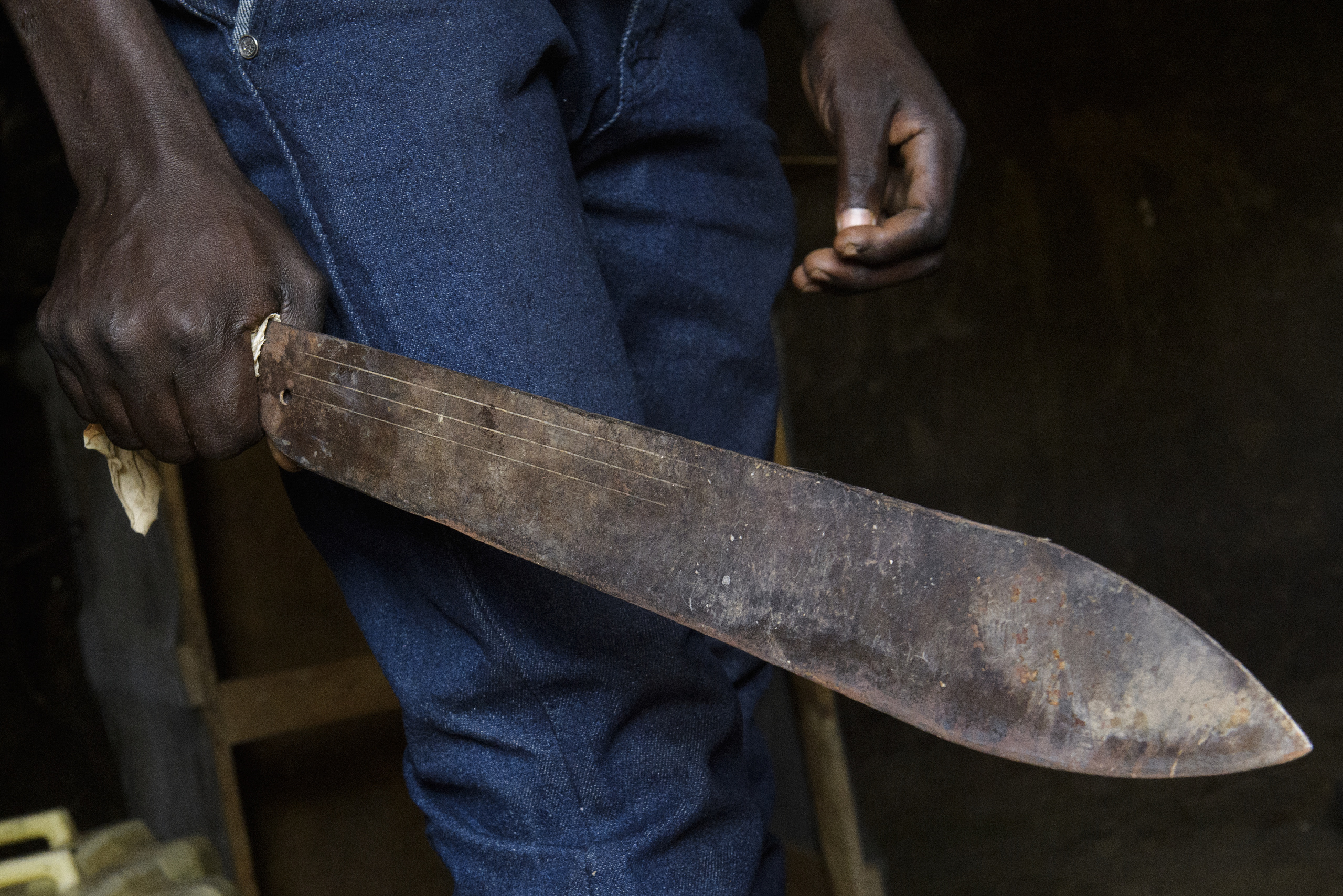 Soroti,UGANDA.
A man showing his machete.
The Machete is the weapon usually used during fights.