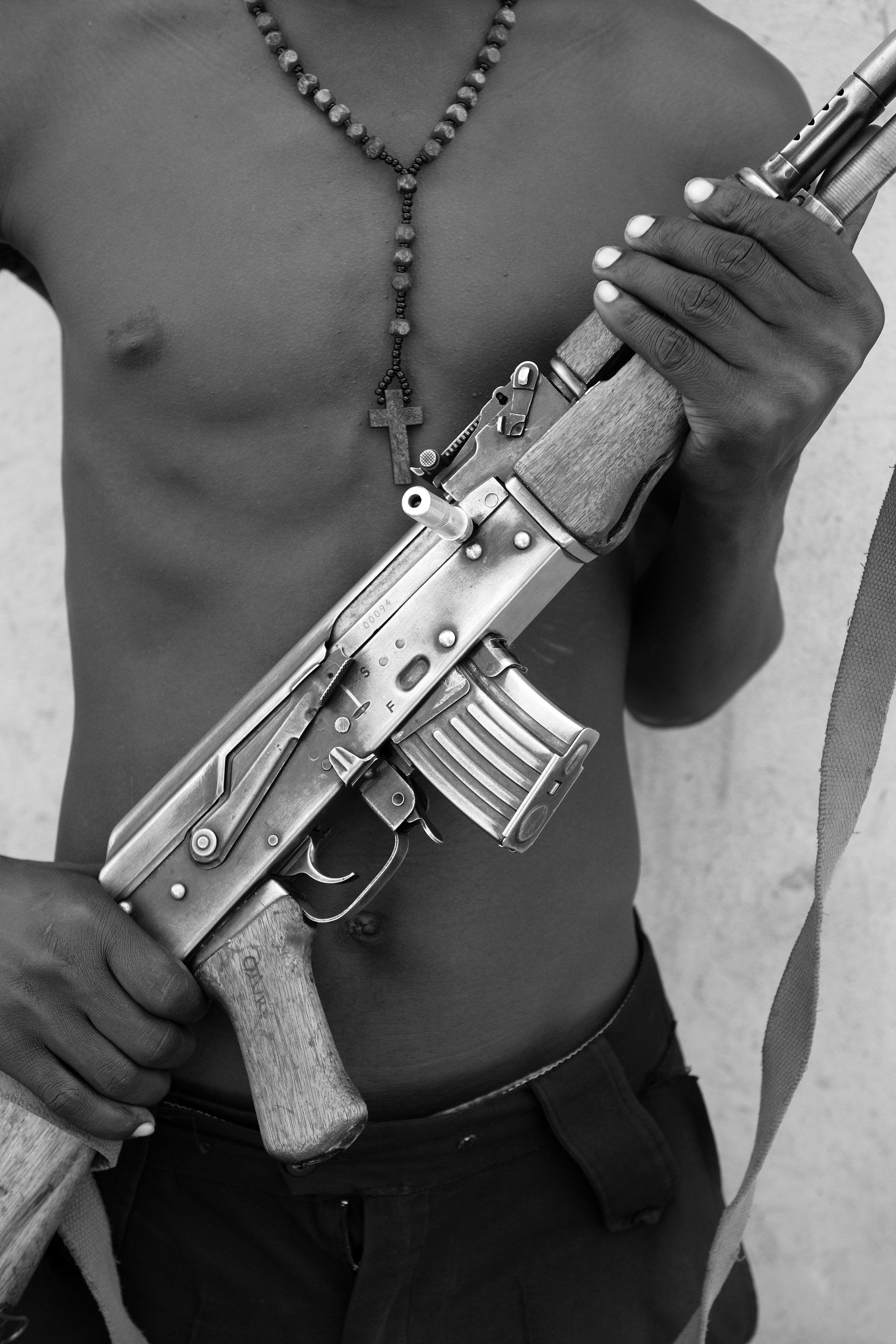 Soroti Uganda.
A man showing his AK47. " I am ready to use it to protect my land and my community."