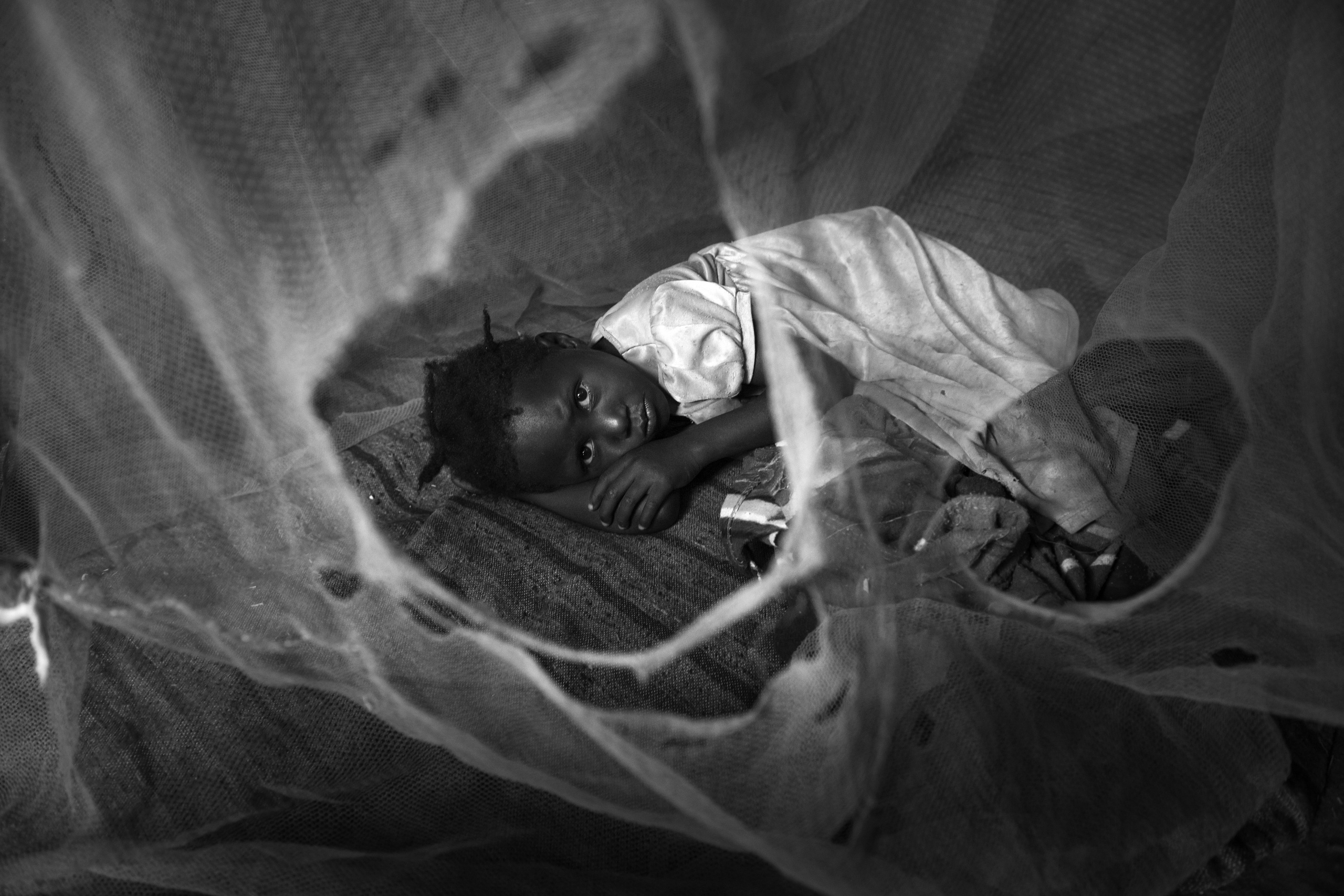 Soroti,UGANDA.
A child inside is bush house.
Malaria is prevalent in Uganda due to the poor living conditions.